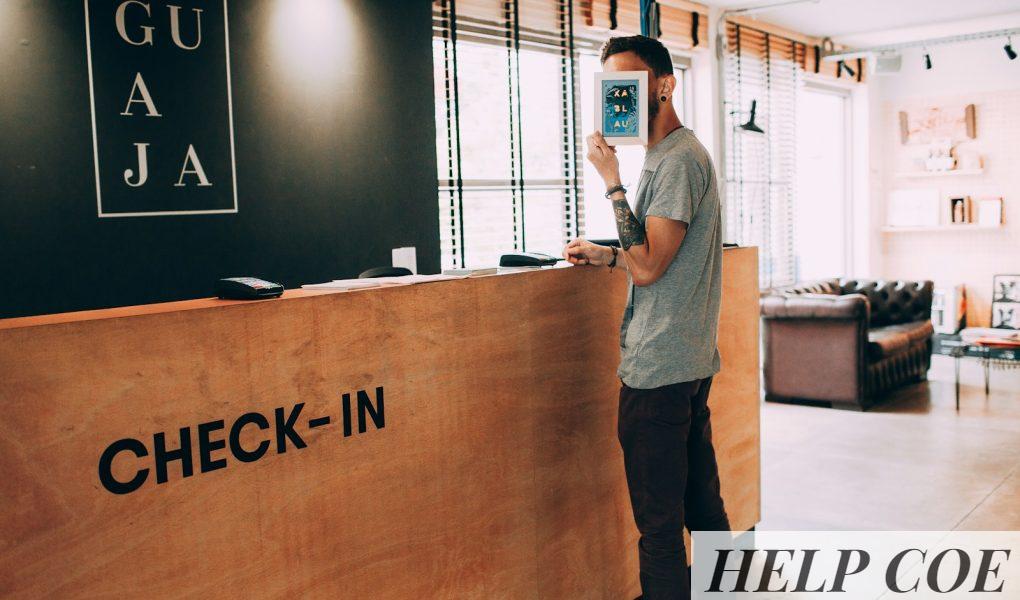man standing beside counter