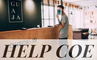 man standing beside counter