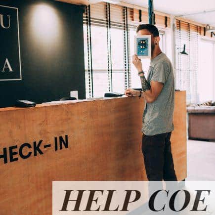 man standing beside counter