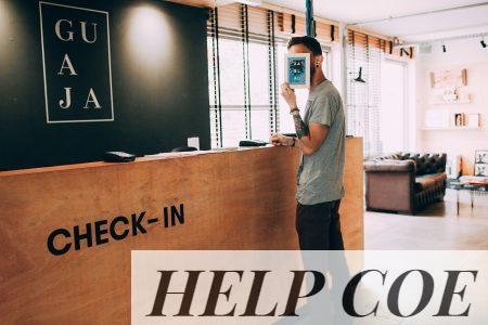 man standing beside counter