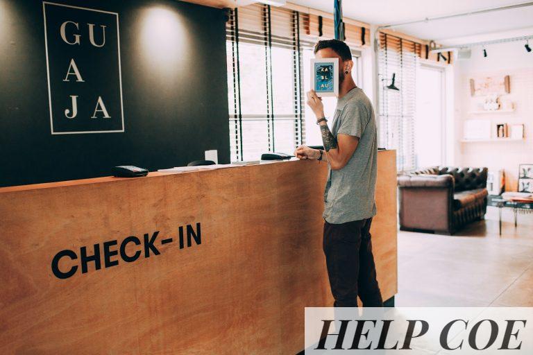 man standing beside counter