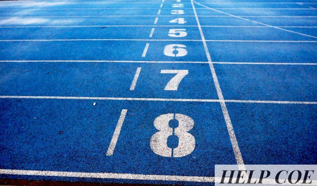 Blue athletic running track with numbered lanes, ideal for sports events and race preparations.
