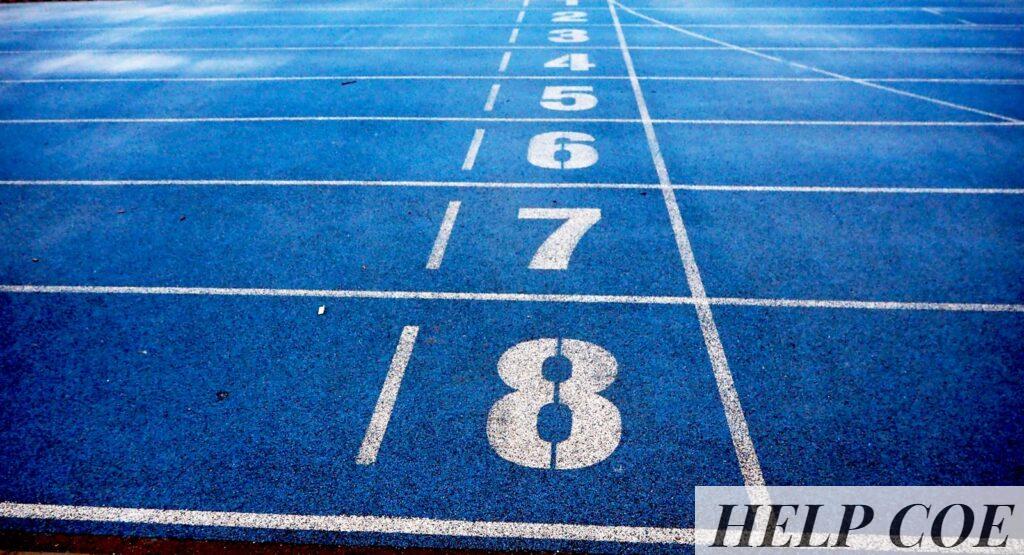 Blue athletic running track with numbered lanes, ideal for sports events and race preparations.