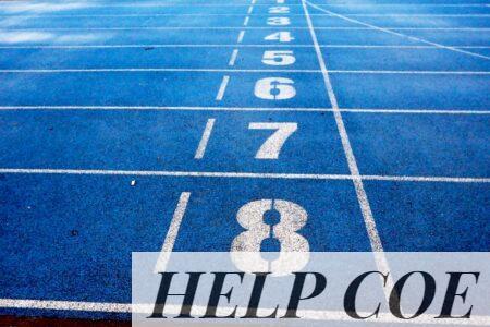 Blue athletic running track with numbered lanes, ideal for sports events and race preparations.
