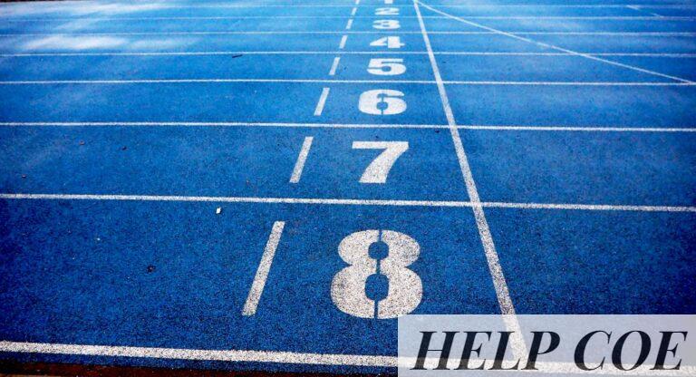Blue athletic running track with numbered lanes, ideal for sports events and race preparations.