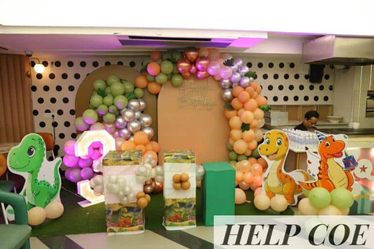 Dinosaur themed birthday party decorations with balloons